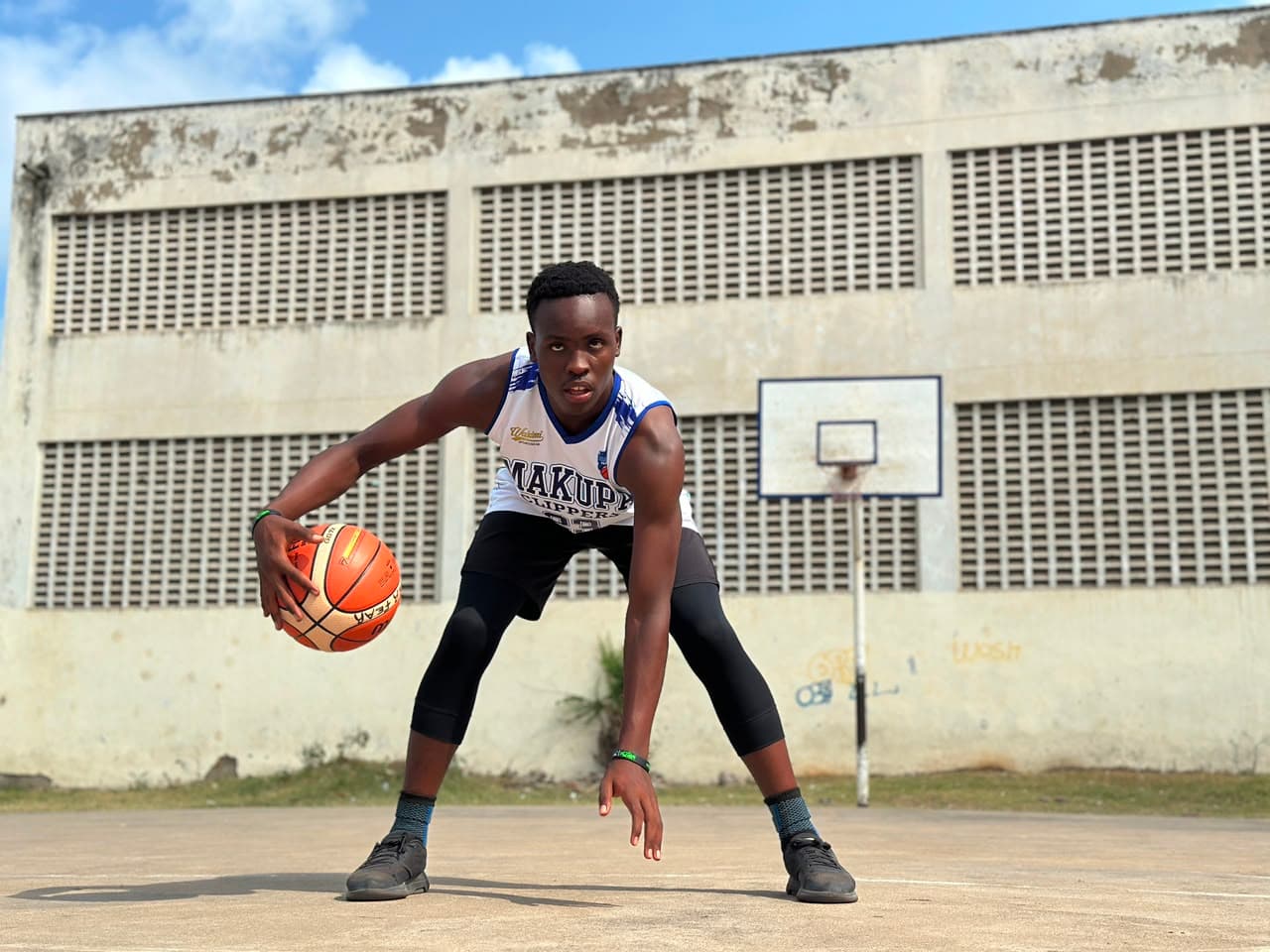 Makupa Clippers player dribbling on the court